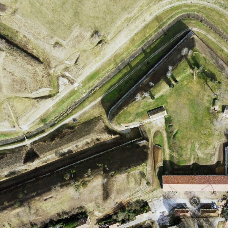 Lunette of Palmanova (UD), FVG, Italy. Triangular terreplein with a stone retaining wall and a central casemate. It is surrounded by a dry moat.