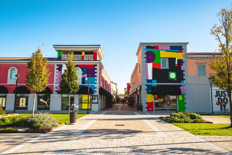 Fun and Style in Shopping: Exterior View of Palmanova Outlet Village, where each visit is a dive into fashion and convenience.